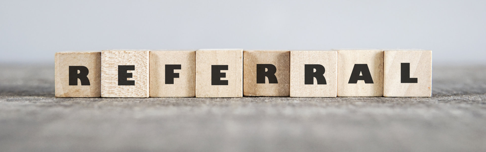 Blocks of letter forming the word 'Referral'
